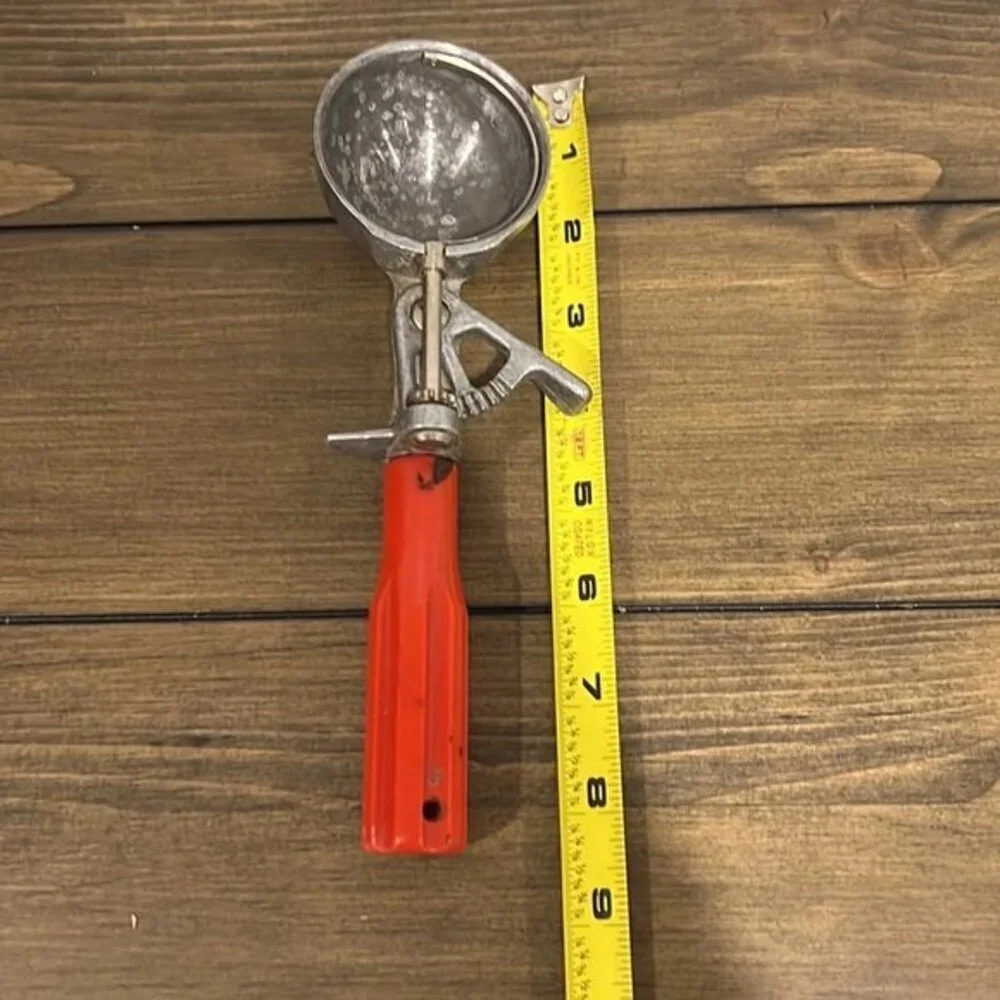 Vintage scoop master ice cream scoop with red handle